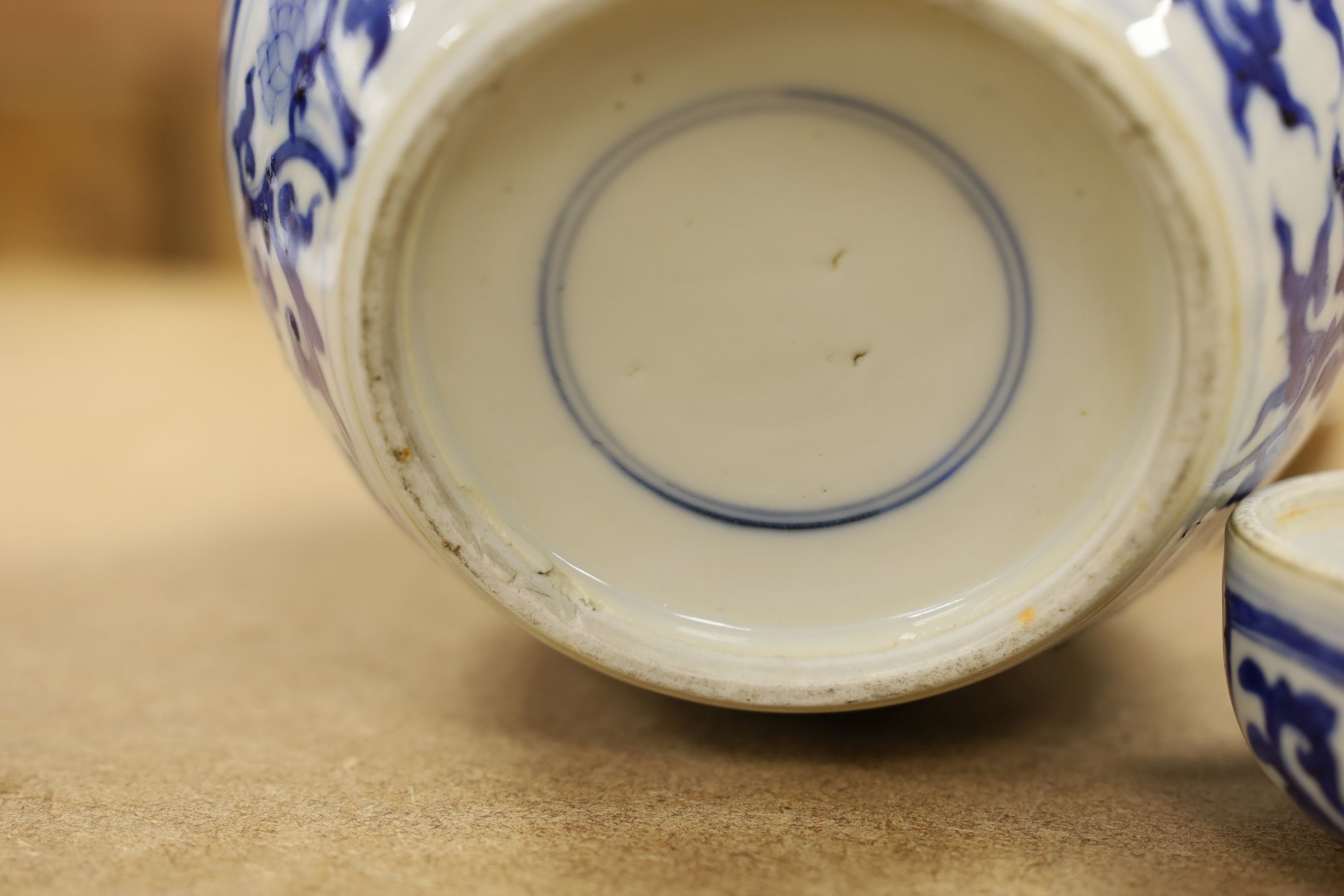 A pair of Chinese blue and white ginger jars and covers, 22cm, On stands